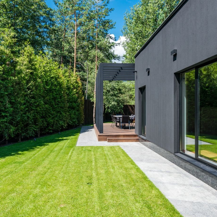 Illustrative licensed photograph: Modern home and landscaping