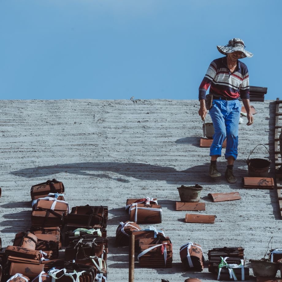 Illustrative licensed photograph: Roof tile installation
