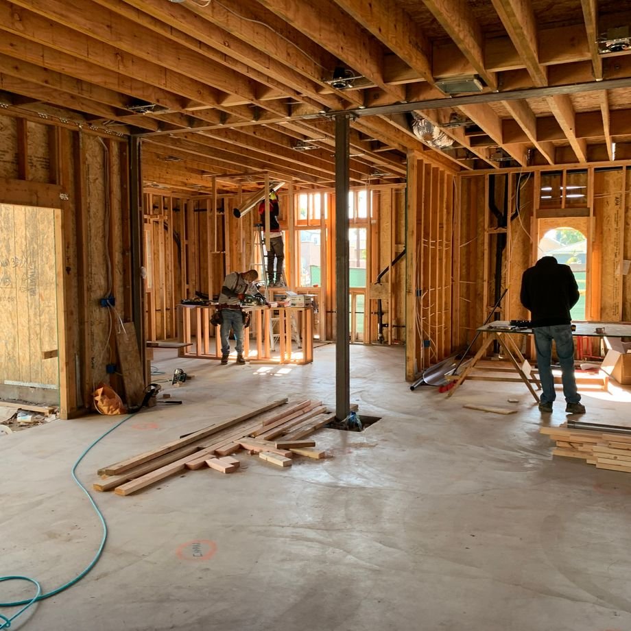Illustrative licensed photograph: House framing under construction