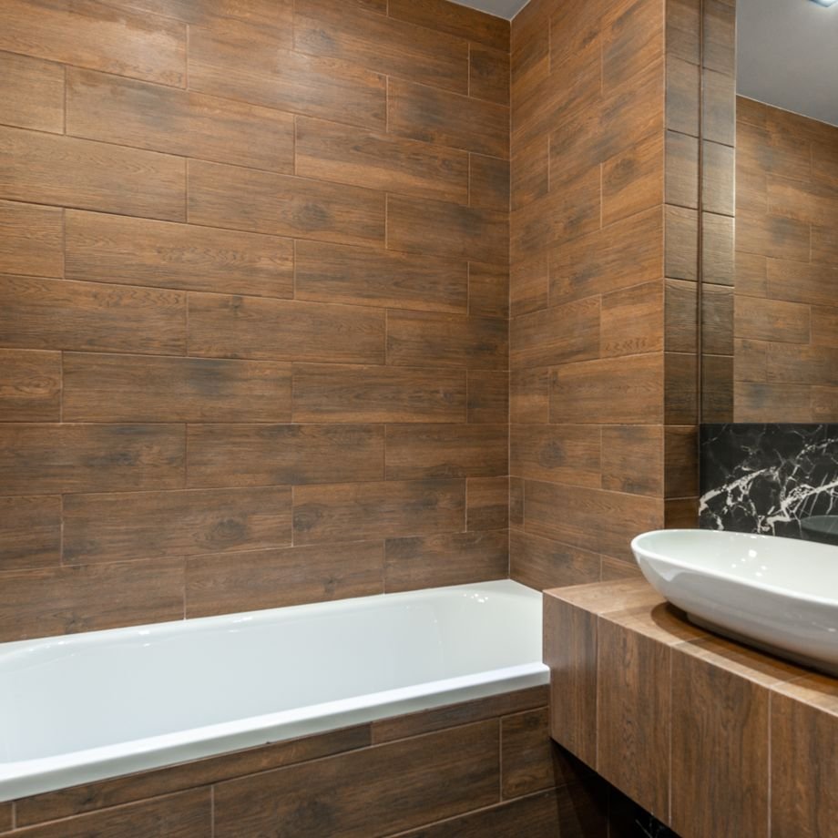 Illustrative licensed photograph: Modern renovated bathroom with wood-effect tiling