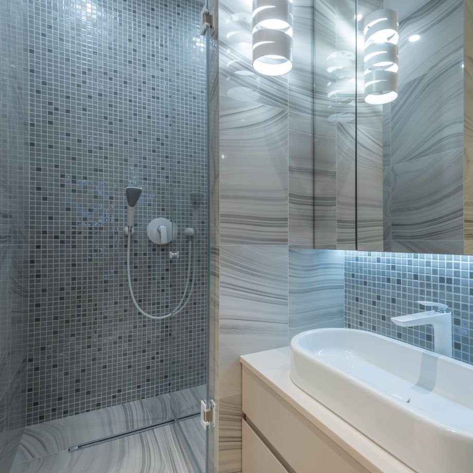 Illustrative licensed photograph: Modern residential bathroom with enclosed shower