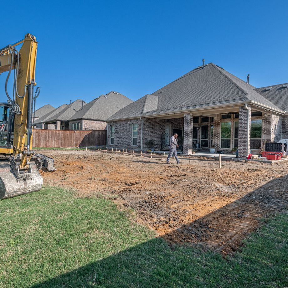 Illustrative licensed photograph: Backyard patio being constructed at a Texas house